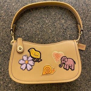 COACH - Swinger 20 With Creature Patches